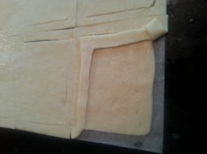 Puff pastry square with cuts to make sides of tart.
